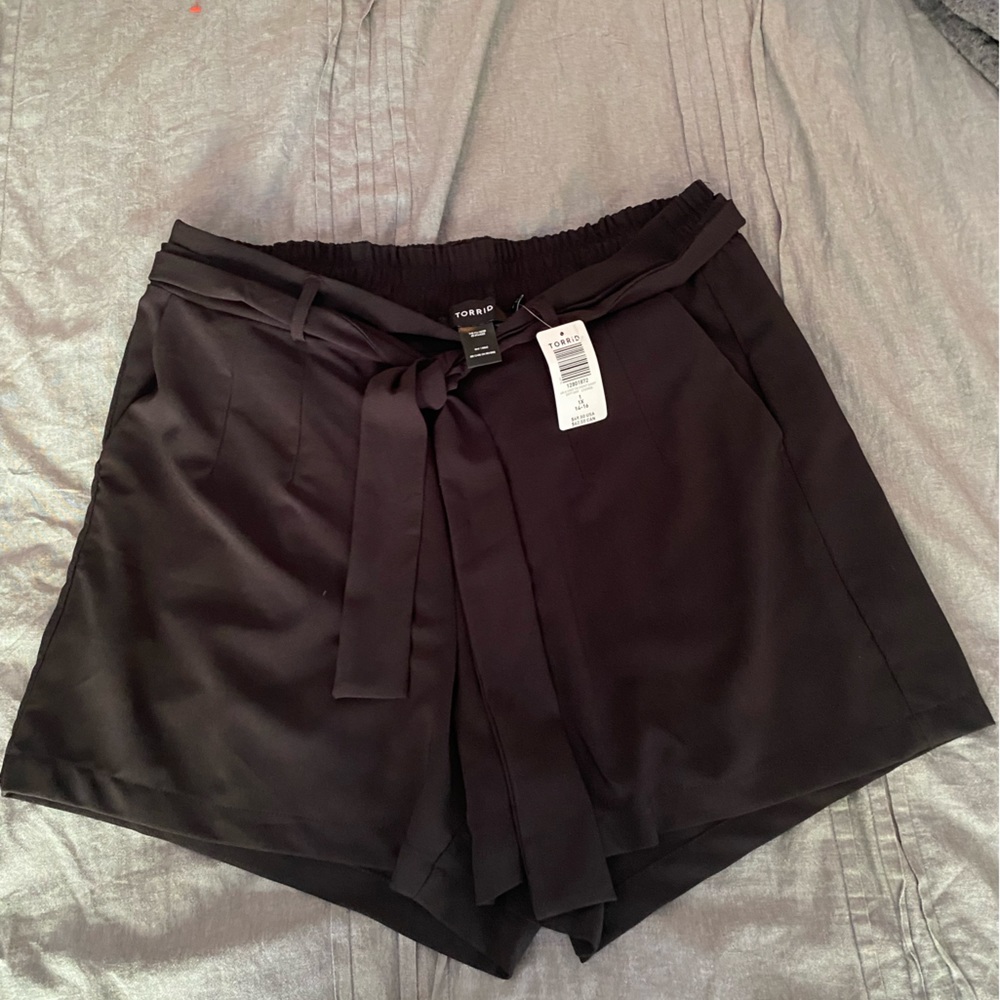 Torrid dress short and dress pant.